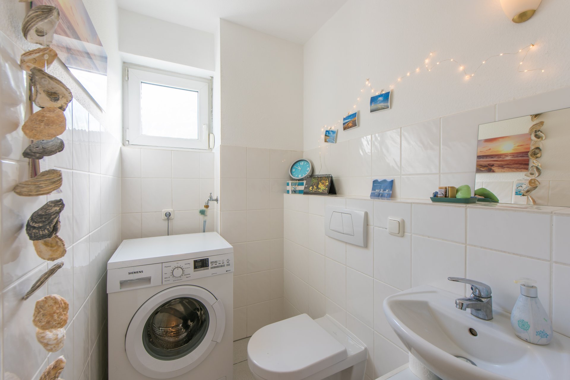 Gäste WC mit genug Platz für die Waschmaschine, die kann aber auch in den Keller - Oliver Reifferscheid - Immobilienmakler Darmstadt